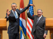 <p>Cuban President Raul Castro lifts up the arm of President Barack Obama at the conclusion of their joint news conference at the Palace of the Revolution, Monday, March 21, 2016 in Havana, Cuba. (AP Photo/Pablo Martinez Monsivais) </p>