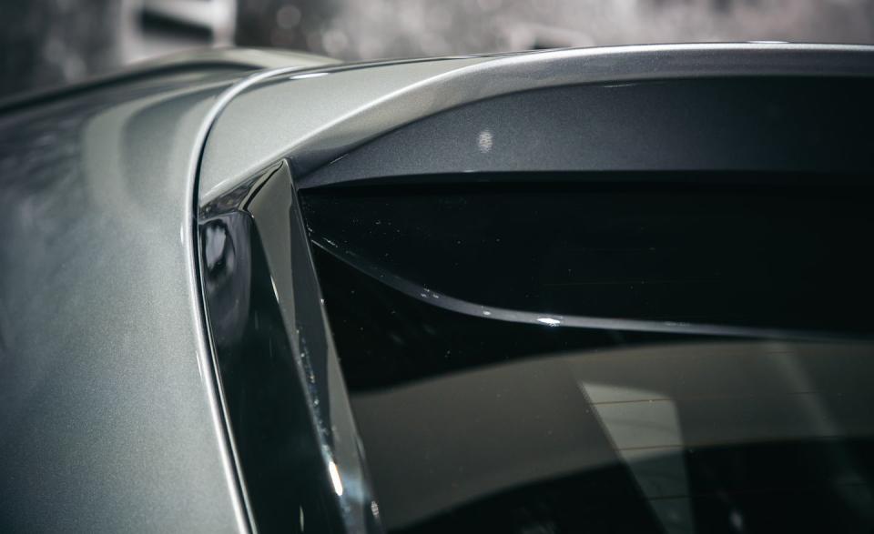 <p>Nearly every modern SUV has small roof spoilers that improve aerodynamic performance. Kia has applied this trick to the Telluride and added smaller vertical skirts (also an emerging trend among competitors) along each side of the rear window to further reduce turbulence in the air passing by the rear end. Kearns says the "cliché" route would have been to blend the spoiler and skirts into a single, body-color piece that wraps around the tailgate. Instead, the Telluride sports separate, blacked-out skirts on each side of its rear glass beneath a body-color spoiler.</p>