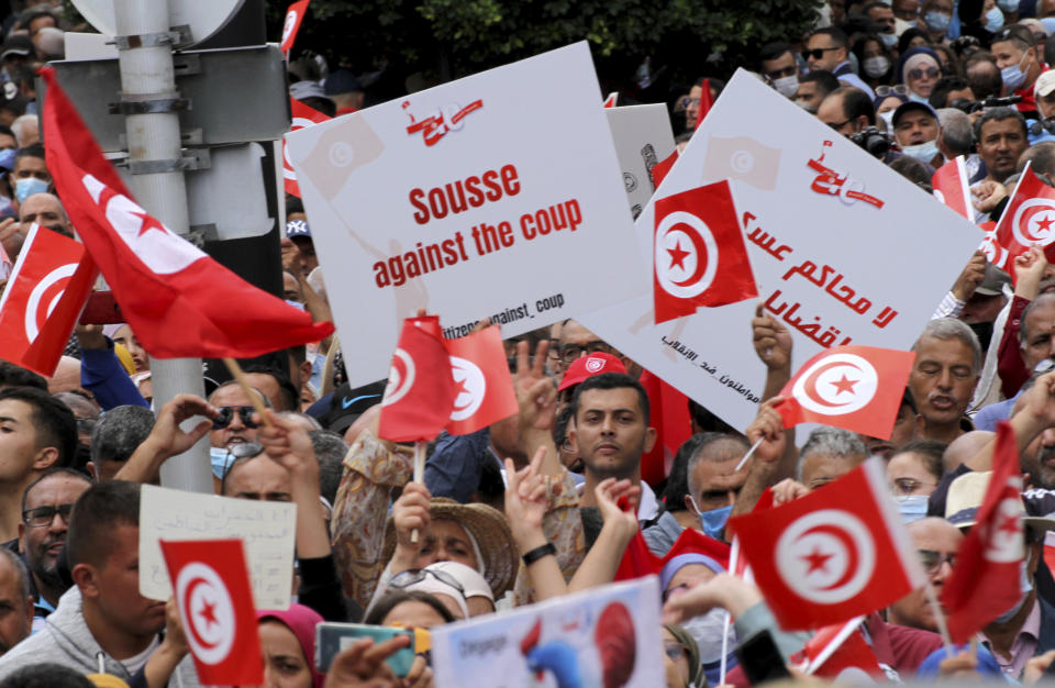 Tunisians demonstrate against Tunisian President Kais Saied in Tunis, Tunisia. Sunday, Oct. 10, 2021. Thousands of people demonstrated in Tunisia’s capital Sunday against the president’s seizure of powers in July and other moves seen as threatening the country’s democratic gains since the Arab Spring. (AP Photo/Hassene Dridi)