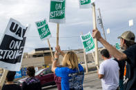 General Motors employees demonstrate outside the Flint Assembly Plant on Sunday, Sept. 15, 2019, in Flint, Mich. The United Auto Workers union says its contract negotiations with GM have broken down and its members will go on strike just before midnight on Sunday. (Jake May/The Flint Journal via AP)