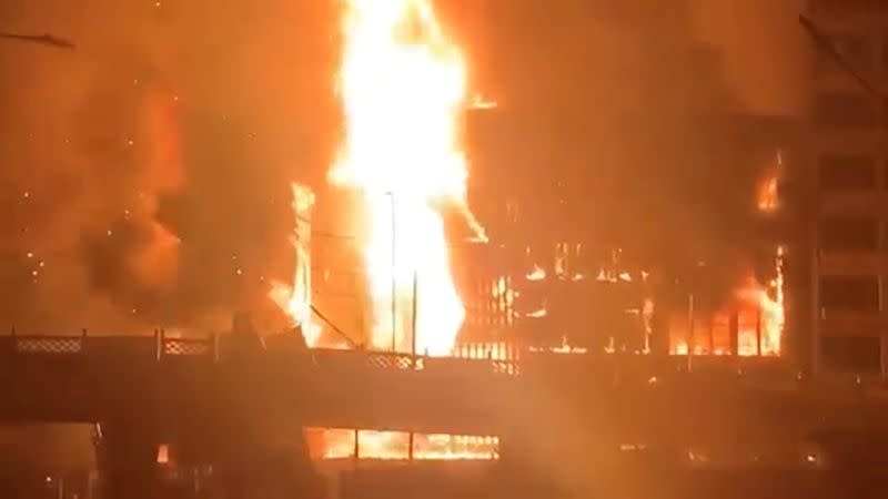 Ruby Mart is engulfed in flames, in Yangon