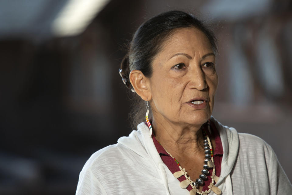 FILE - Secretary of the Interior Deb Haaland speaks at a news conference in Yellowstone National Park on Friday, July 8, 2022. The U.S. government has joined a ski resort and others that have quit using a racist term for a Native American woman by renaming hundreds of peaks, lakes, streams and other geographical features on federal lands in the West and elsewhere. Haaland in November declared the term derogatory and ordered members of the Board on Geographic Names, the Interior Department panel that oversees uniform naming of places in the U.S., and others to come up with alternatives. (Rachel Leathe/Bozeman Daily Chronicle via AP, File)