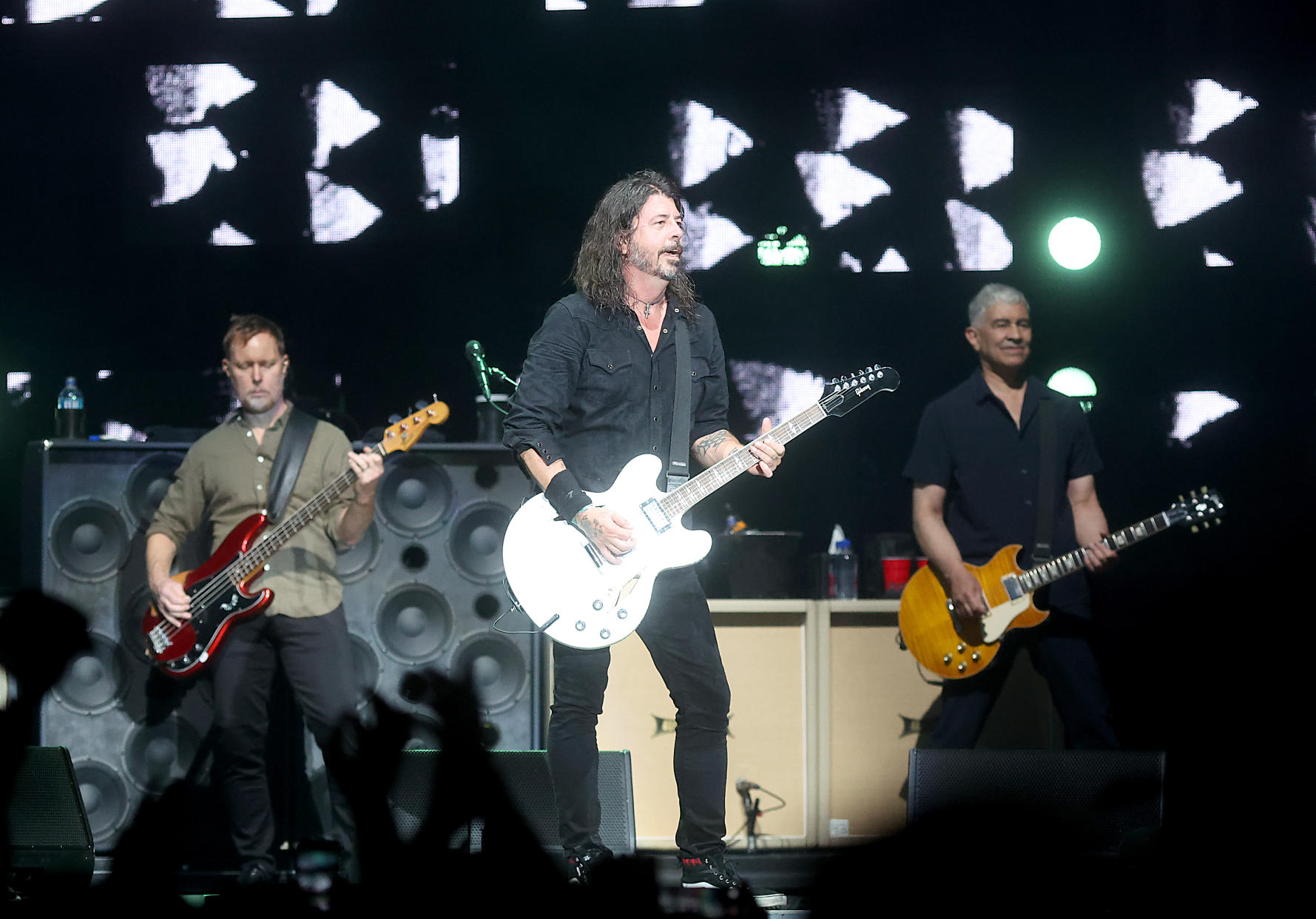 MANCHESTER, TENNESSEE - JUNE 18: (L - R) Nate Mendel, Dave Grohl and Pat Smear of Foo Fighters perform in concert during Bonnaroo Music & Arts Festival on June 18, 2023 in Manchester, Tennessee. (Photo by Gary Miller/WireImage)