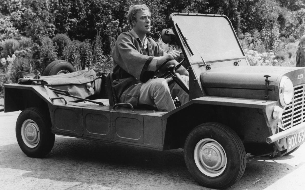 Michael Caine driving the Mini Moke