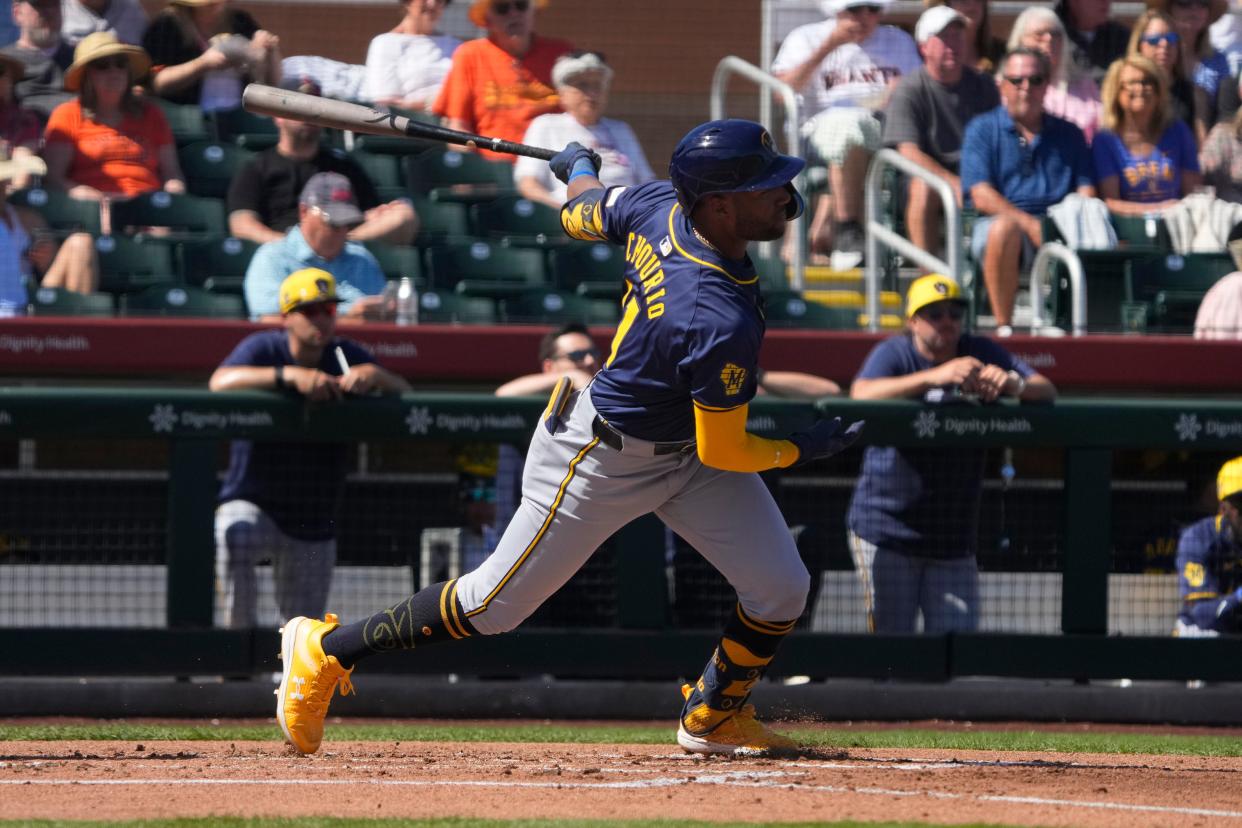 Jackson Chourio cracks an RBI double during the Brewers' four-run first inning against the Giants on Tuesday at Scottsdale Stadium.