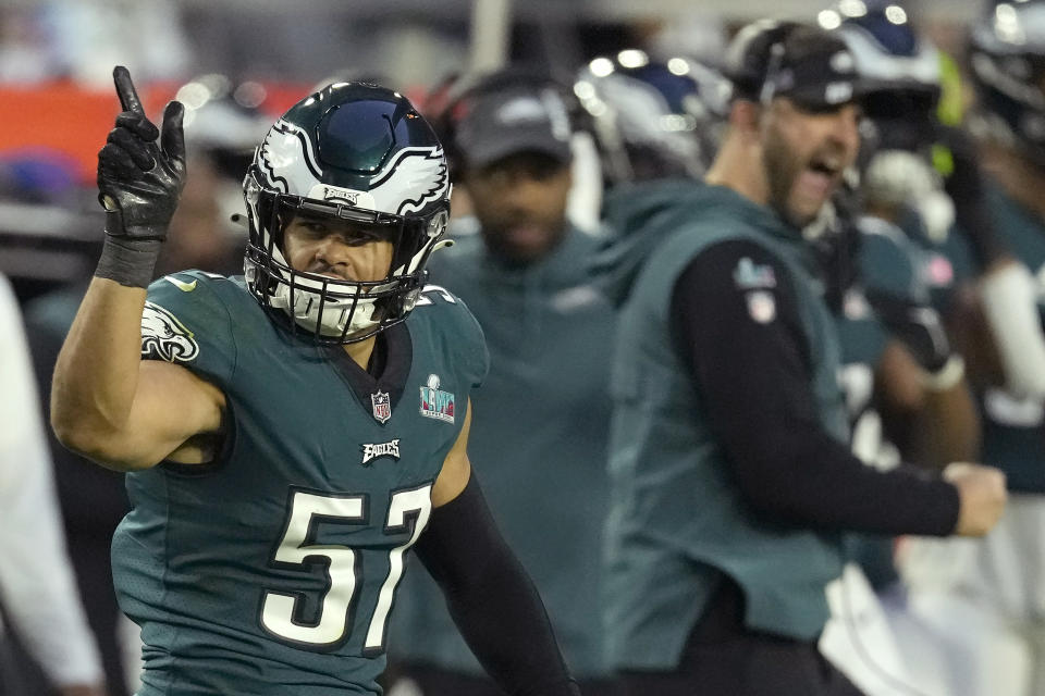 FILE - Philadelphia Eagles linebacker T.J. Edwards (57) celebrates next to head coach Nick Sirianni, right, after tackling Kansas City Chiefs quarterback Patrick Mahomes during the first half of the NFL Super Bowl 57 football game, Sunday, Feb. 12, 2023, in Glendale, Ariz. A person familiar with the situation says the Chicago Bears have agreed to a three-year, $19.5 million deal with former Philadelphia Eagles player T.J. Edwards. Edwards is guaranteed $12 million. The person spoke Monday, March 13, on the condition of anonymity because the agreement can’t be announced until the new league year opens on Wednesday. (AP Photo/Seth Wenig, File)