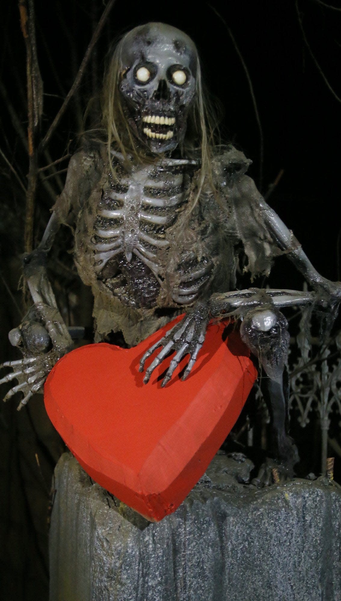 A skeleton holds onto a heart for a previous Valentine's Haunted House at the Haunted Schoolhouse in Akron, Ohio.