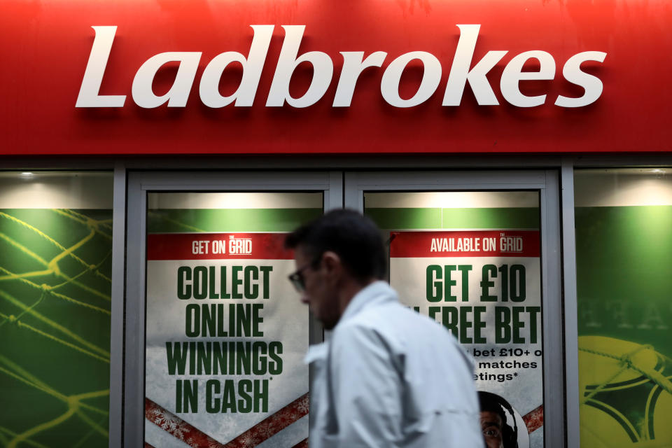 A pedestrian walks past a branch of Ladbrokes in London, Britain December 22, 2017. REUTERS/Simon Dawson