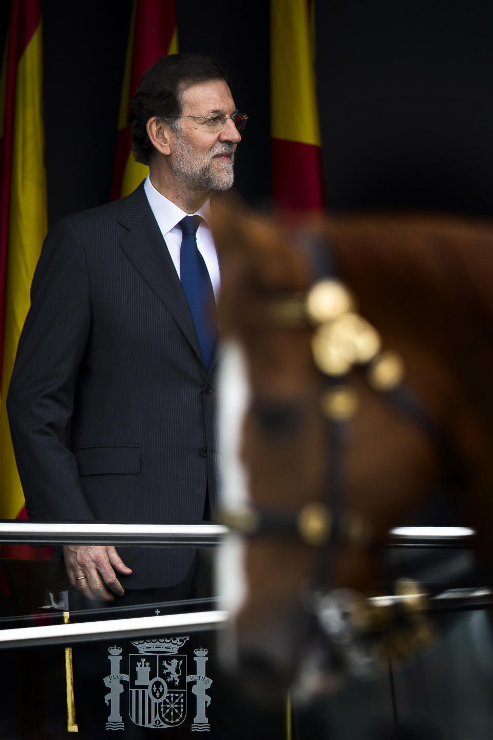 Spain's Prime Minister Mariano Rajoy attends a military parade, during the holiday known as Dia de la Hispanidad, Spain's National Day, in Madrid, Friday, Oct. 12, 2012. Spain is observing its National Day festivities in somber mood as the traditional military pageant was scaled back to cut costs. Spain is in recession and under pressure to fix its finances while celebrating the day Christopher Columbus discovered America in the name of the Spanish Crown. (AP Photo/Daniel Ochoa de Olza)