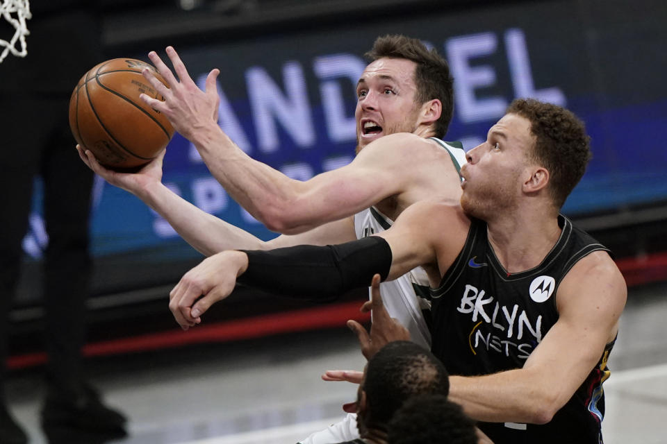 Milwaukee Bucks guard Pat Connaughton (24) reacts after he was fouled by Brooklyn Nets forward Blake Griffin while going up for a layup during the first half of Game 5 of a second-round NBA basketball playoff series Tuesday, June 15, 2021, in New York. (AP Photo/Kathy Willens)