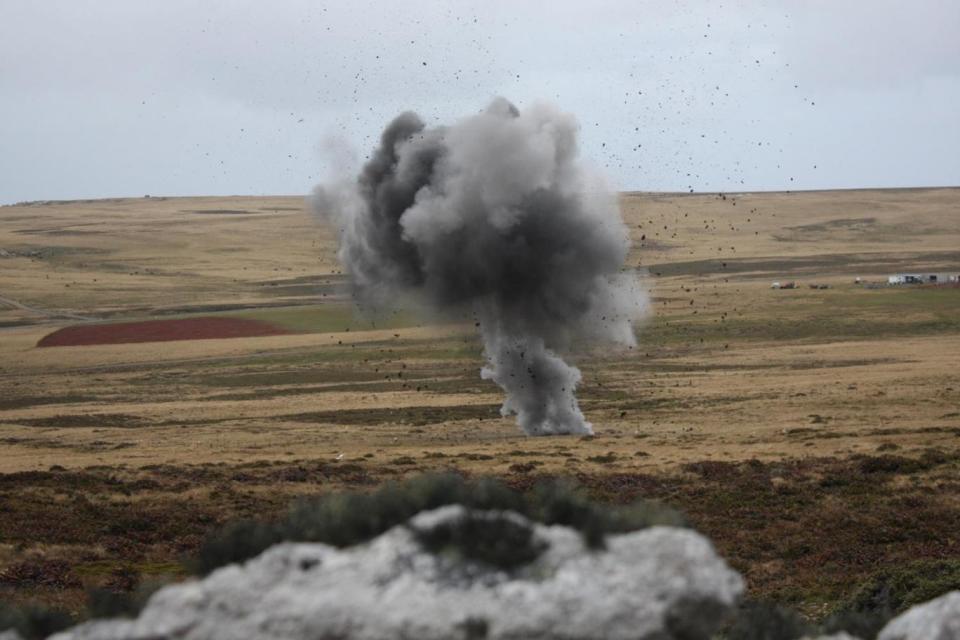 A land mine explodes in the distance (Robert Fox)