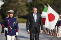 Italy's Defense Minister Guido Crosetto, center, inspects a Guard of Honor before a bilateral meeting with Japan's Defense Minister Yasukazu Hamada Thursday, March 16, 2023, in Tokyo, Japan. (Takashi Aoyama/Pool Photo via AP)