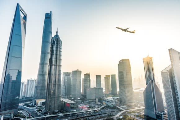 Plane flying over skyscrapers in China