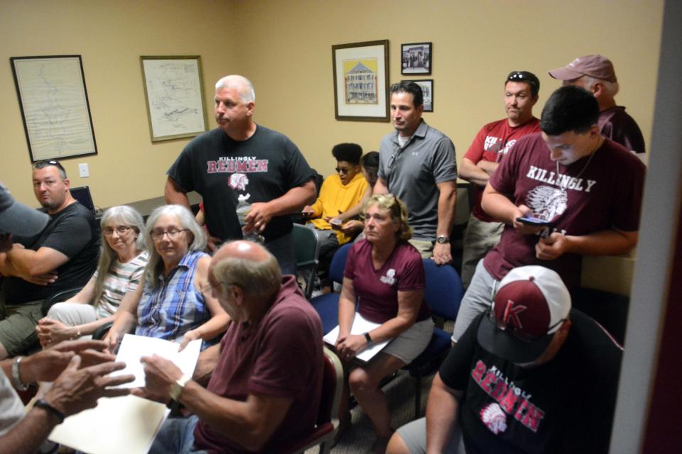 People crammed into an overflow room and stood in the hallway during a Killingly Board of Education meeting on the Killingly High School Redmen mascot controversy July 26, 2019, at Killingly Town Hall.