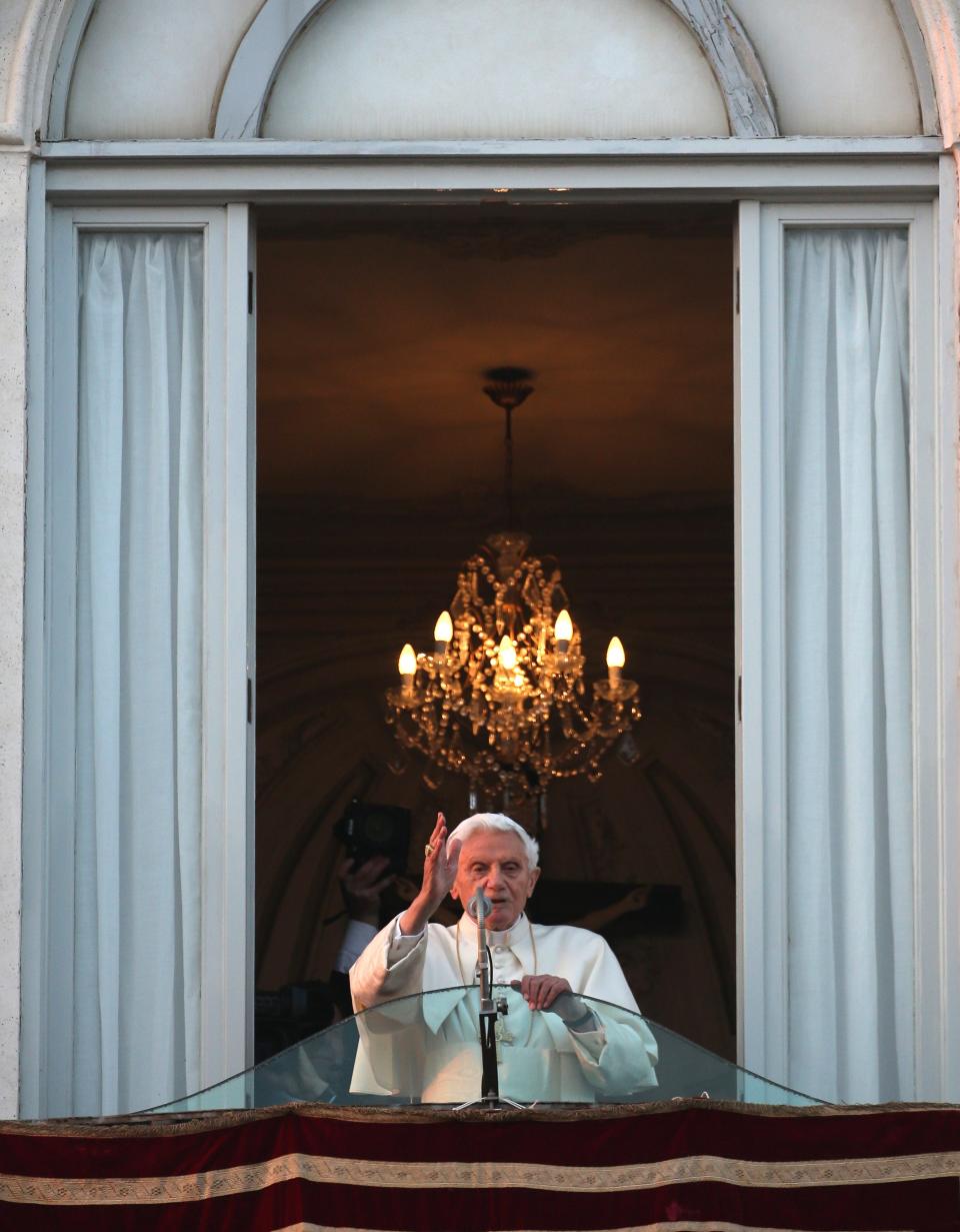 Pope Benedict XVI blesses pilgrims, for the last time as head of the Catholic Church, from the window of Castel Gandolfo, where he started his retirement on Feb. 28, 2013, in Rome, Italy.