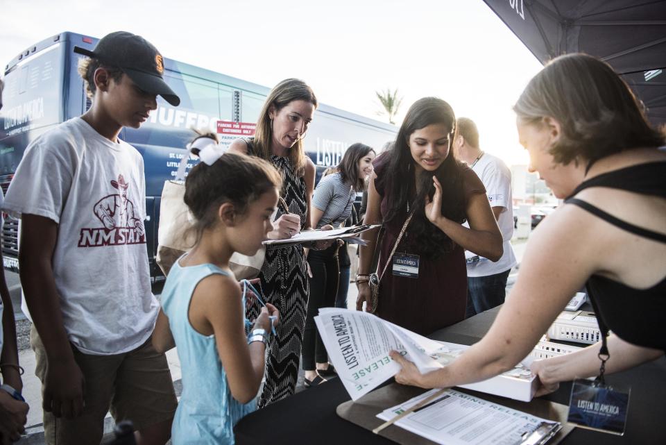 People visit the "Listen to America" tents.