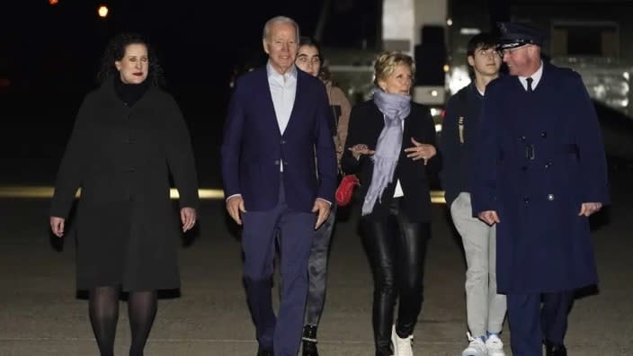 President Joe Biden and First Lady Jill Biden arrive to board Air Force One at Andrews Air Force Base, Md., on Tuesday with their grandchildren Natalie and Robert, escorted by Air Force Col. William Chris McDonald (right) and his wife, Diana McDonald (left). Biden and his family are traveling to St. Croix, U.S. Virgin Islands. (Photo: Manuel Balce Ceneta/AP)