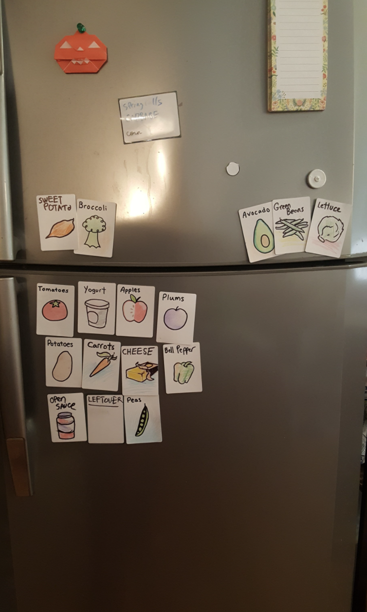 Photo shows a fridge with labels for fruit and vegetables.