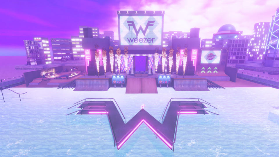 A wintry realm with a big W in the snow below a big screen displaying "Weezer."