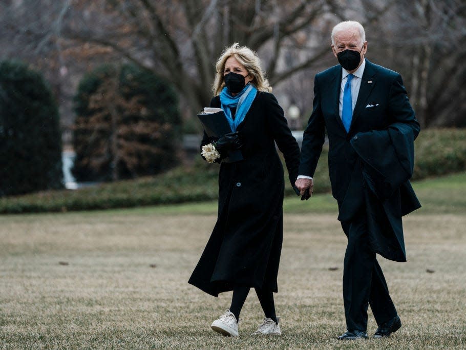 Joe Biden and Jill Biden wear matching blue accessories.