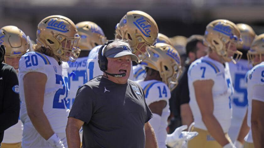 UCLA head coach Chip Kelly looks on from the sidelines during the first half of an NCAA.