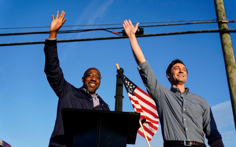 Raphael Warnock, left, and Jon Ossoff, right hope to give the Democrats control of Congress - AP