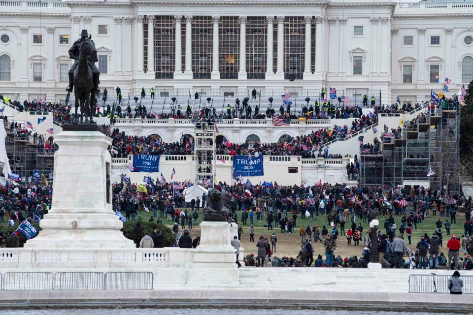 Rioters with Donald Trump flags stormed the U.S. Capitol Building while Congress met to certify electoral votes confirming Joe Biden as president in Washington, D.C. on Jan. 6, 2021.