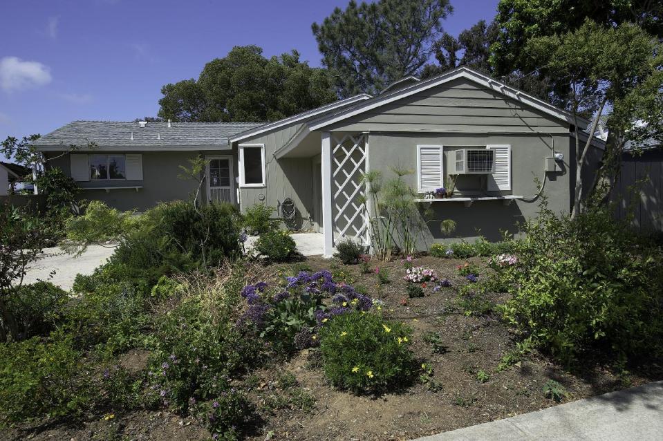 This undated photo released courtesy Bob Walker showing Bob Walker and Frances Mooney's home after it was painted to sell in San Diego Calif. Walker and Mooney moved into the house in 1986 and started converting it into a human-sized cat condo with 140 feet of elevated highway, tunnels, ramps, a spiral staircase, rest areas and scenic vistas. It even had a floor to ceiling scratching post. One improvement seemed to lead to another. (AP Photo/Courtesy Bob Walker)