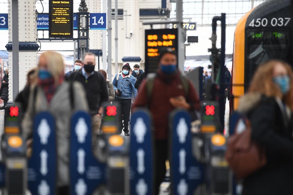 Passengers at Waterloo (PA Archive)