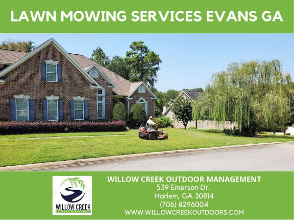 Evans GA lawn mowing services man on riding lawn mower in front yard