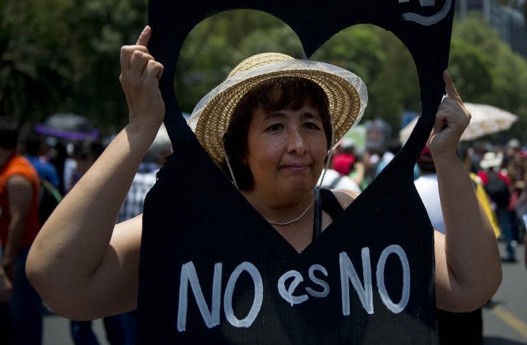 A woman joins a protest rally in Mexico City against the sexual harassment and violence against women