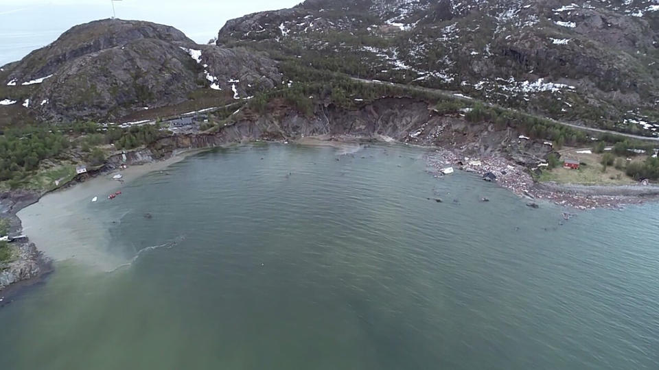 The scene of a landslide near Alta, Arctic Norway, seen Wednesday June 3, 2020, after a powerful landslide that took some eight houses into the sea off northern Norway. Police spokesman Torfinn Halvari said a car was taken in the landslide but no people injured. (Anders Bjordal via AP)