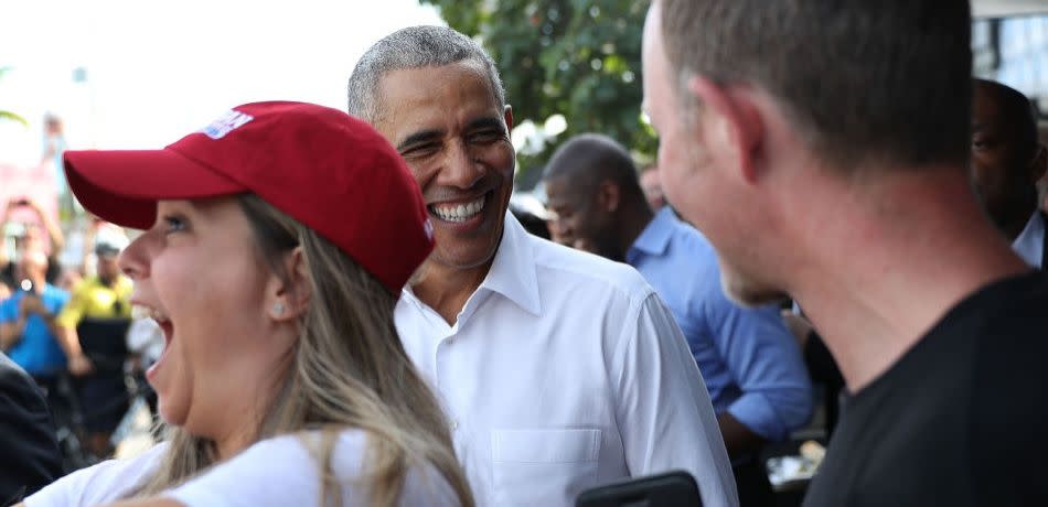 Former U.S. President Barack Obama greets people as he departs from the Coyo Taco restaurant after ordering lunch on November 02, 2018 in Miami, Florida.