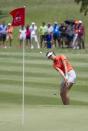 Michelle Wie chips onto the first green in the final round of the LPGA LOTTE Championship golf tournament at Ko Olina Golf Club, Saturday, April 19, 2014, in Kapolei, Hawaii. (AP Photo/Eugene Tanner)