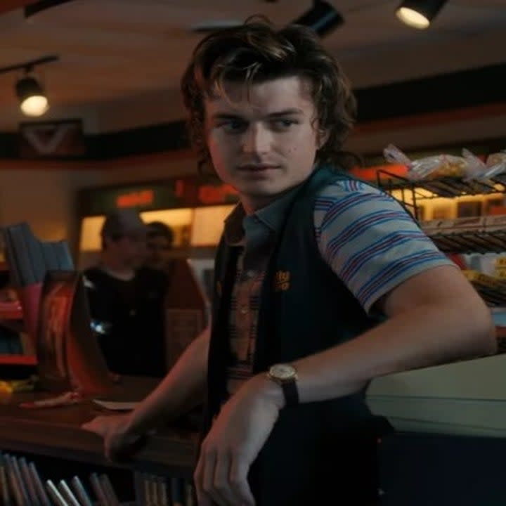 Steve Harrington at a cash register during Stranger Things season 4