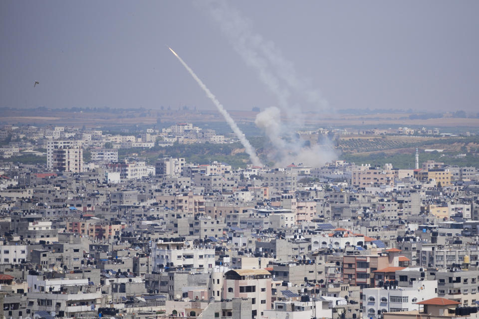 Rockets are launched from the Gaza Strip towards Israel, in Gaza City, Wednesday, May 10, 2023. Israeli aircraft struck targets in the Gaza Strip for a second straight day on Wednesday, killing at least one Palestinian and pushing the region closer toward a new round of heavy fighting. (AP Photo/Hatem Moussa)