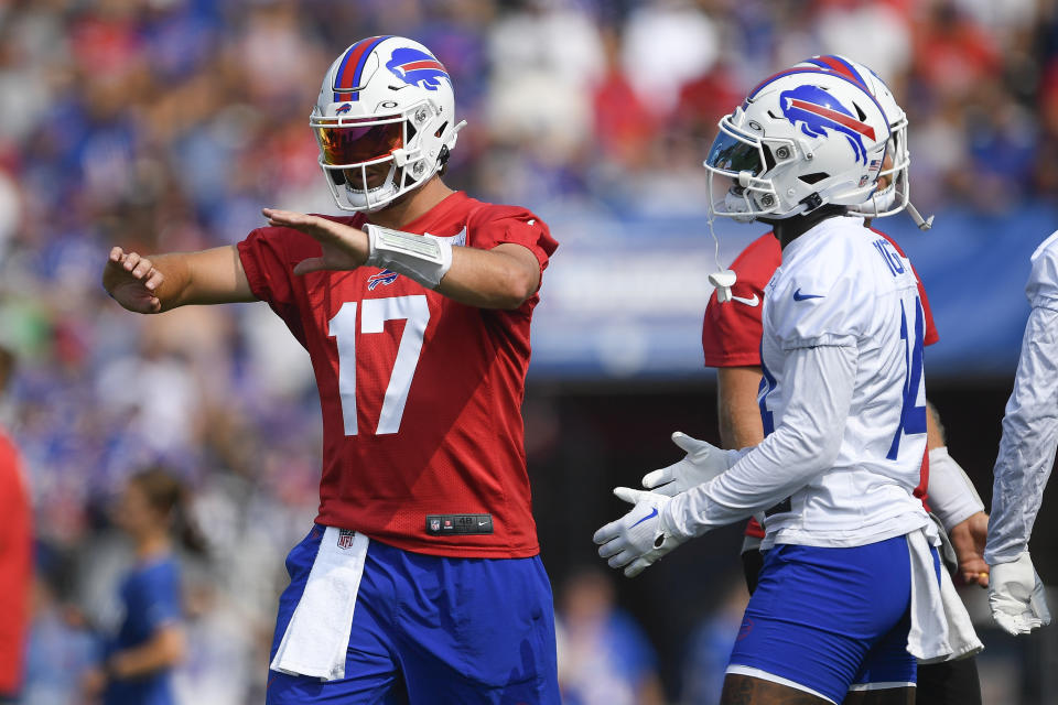 Buffalo Bills quarterback Josh Allen, left, talks to wide receiver Stefon Diggs during practice at the NFL football team's training camp in Pittsford, N.Y., Wednesday, July 26, 2023. (AP Photo/Adrian Kraus)