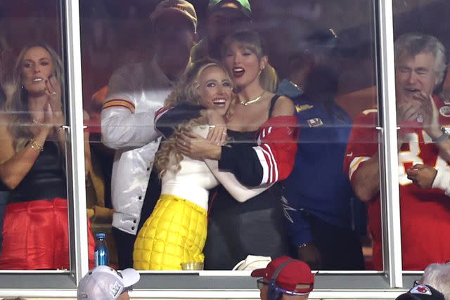 <p>Perry Knotts/Getty Images</p> Lyndsay Bell, Brittany Mahomes and Taylor Swift celebrate during the first half of the game between the Kansas City Chiefs and the Denver Broncos