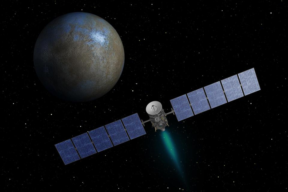 NASA's Dawn spacecraft heads toward the dwarf planet Ceres as seen in this undated artist's conception released January 22, 2014. The dwarf planet Ceres, one of the most intriguing objects in the solar system, is gushing water vapor from its frigid surface into space, scientists said on Wednesday in a finding that raises questions about whether it might be hospitable to life. REUTERS/NASA/JPL-Caltech/Handout via Reuters (OUTER SPACE - Tags: SCIENCE TECHNOLOGY) THIS IMAGE HAS BEEN SUPPLIED BY A THIRD PARTY. IT IS DISTRIBUTED, EXACTLY AS RECEIVED BY REUTERS, AS A SERVICE TO CLIENTS. FOR EDITORIAL USE ONLY. NOT FOR SALE FOR MARKETING OR ADVERTISING CAMPAIGNS