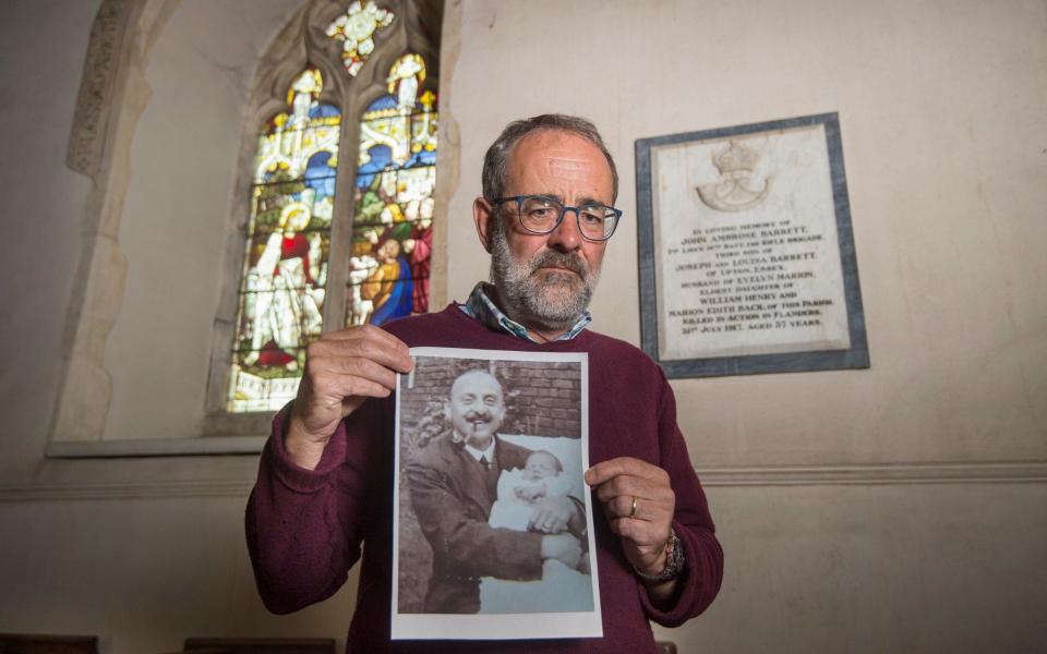 Tim Barrett next to the memorial to his grandfather at St Remigius Church - Credit: Julian Simmonds