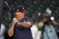 Atlanta Braves manager Brian Snitker hits during batting practice Monday, Oct. 25, 2021, in Houston, in preparation for Game 1 of baseball's World Series tomorrow against the Houston Astros. (AP Photo/David J. Phillip)