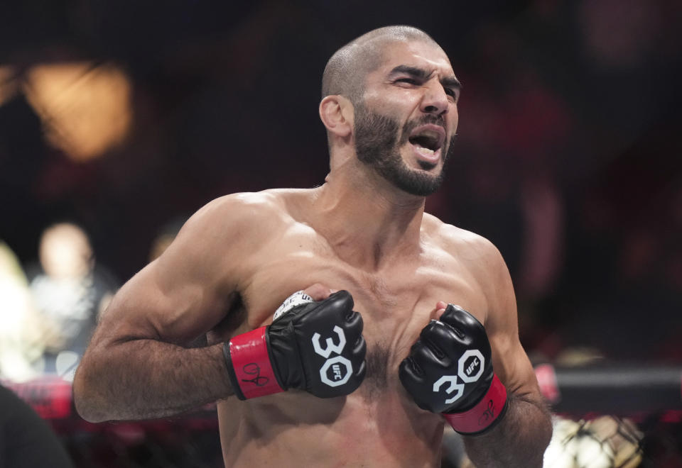 Aiemann Zahabi celebrates after knocking out Aoriqileng during a bantamweight bout at UFC 289 in Vancouver, British Columbia on Saturday, June 10, 2023. (Darryl Dyck/The Canadian Press via AP)