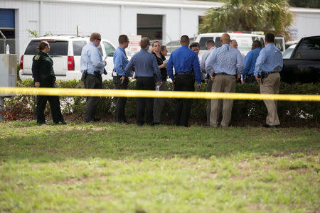 Investigators work the scene of a fatal workplace shooting in Orlando, Florida, U.S. June 5, 2017. REUTERS/Daniel LeClair