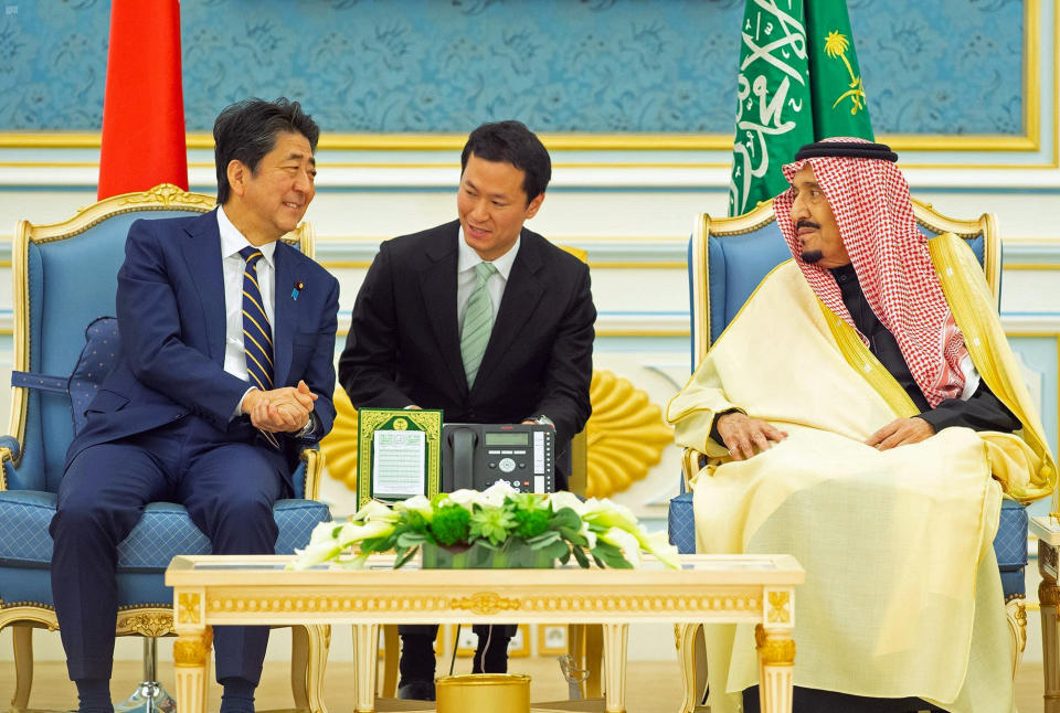 In this photo released by Saudi Press Agency, SPA, Saudi King Salman, right, receives Japan's Prime Minister Shinzo Abe, in Riyadh, Saudi Arabia, Sunday, Jan. 12, 2020. (Saudi Press Agency via AP)