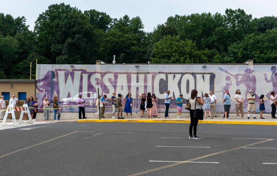 Supporters line up hours before the campaign rally for Vice President Kamala Harris, where Pennsylvania Governor Josh Shapiro and Michigan Governor Gretchen Whimer are due to speak, at Wissahickon High School in Ambler on Monday, July 29, 2024.