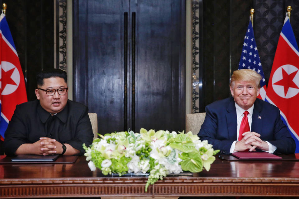 Kim Jong-un and Donald Trump sign their joint agreement (Picture: Getty)