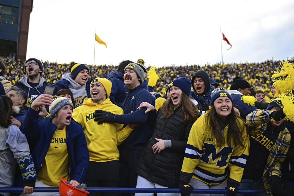 Michigan fans celebrate during the second half of an NCAA college football game against Ohio State, Saturday, Nov. 25, 2023, in Ann Arbor, Mich. Michigan won 30-24. (AP Photo/David Dermer)