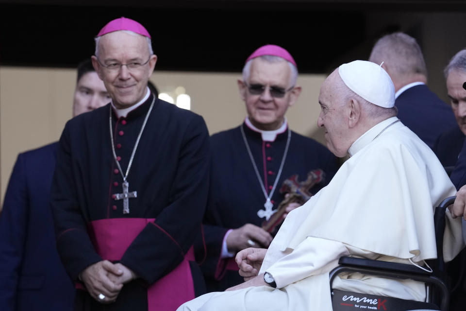 Pope Francis smiles as he arrives or a meeting with priests, religious men and women, seminarians and catechists as Bishop Athenasius Schneider, auxiliary bishop of Astana, looks him, at the Our Lady Of Perpetual Help Cathedral in Nur-Sultan, Kazakhstan, Thursday, Sept. 15, 2022. Pope Francis is on the third day of his three-day trip to Kazakhstan. (AP Photo/Andrew Medichini)