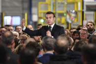 French President Emmanuel Macron delivers a speech as he visits a plant of British-Swedish pharmaceutical group Astrazeneca in Dunkirk, northern France, Monday, Jan. 20, 2020. French President Emmanuel Macron is hosting 180 international business leaders later today at the Palace of Versailles in a bid to promote France's economic attractiveness despite over six weeks of crippling strikes over his government's planned pension changes.(Denis Charlet/Pool Photo via AP)