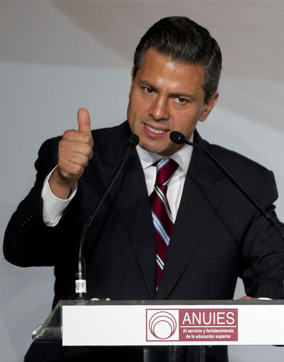 Enrique Pena Nieto, presidential candidate for the Institutional Revolutionary Party (PRI), speaks during a meeting with Mexican universities rectors in Mexico, Monday, May 21, 2012. Pena Nieto, the front-running candidate in the race for Mexico's July 1 presidential election, is pledging to respect transparency and plurality if elected, things his Institutional Revolutionary Party was not known for during 71 years in power. (AP Photo/Eduardo Verdugo)